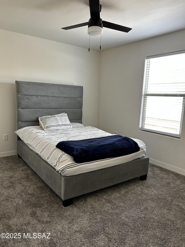 1126 E Descent St, Tucson, AZ 85719 - carpeted bedroom with baseboards and a ceiling fan