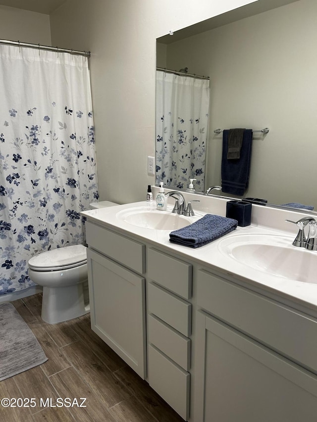 1126 E Descent St, Tucson, AZ 85719 - full bathroom with wood finished floors, double vanity, and curtained shower