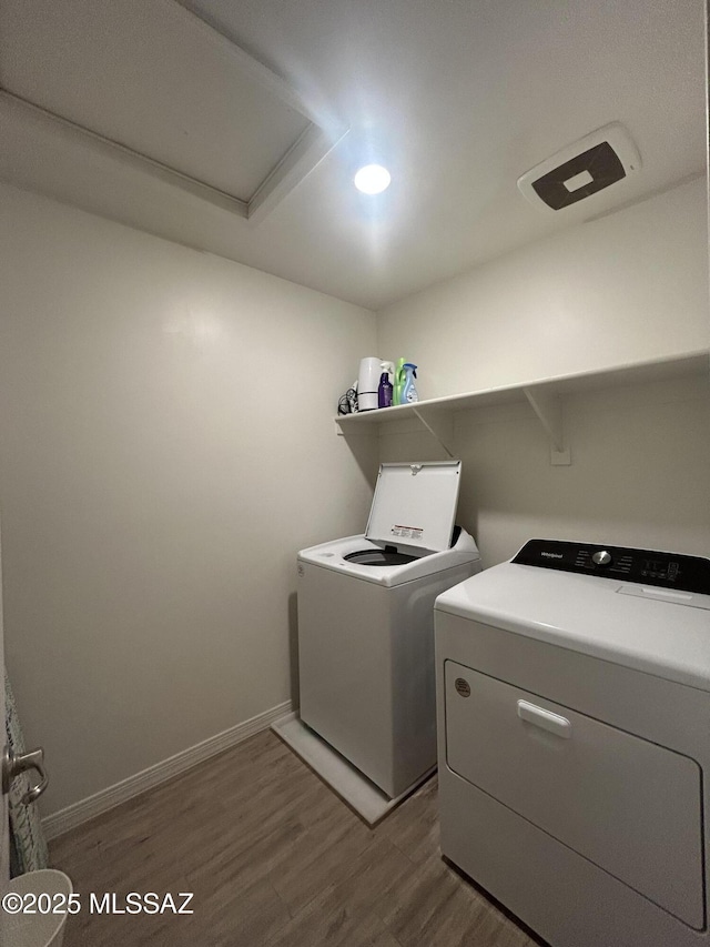 1126 E Descent St, Tucson, AZ 85719 - laundry room with dark wood-style floors, washing machine and dryer, and recessed lighting
