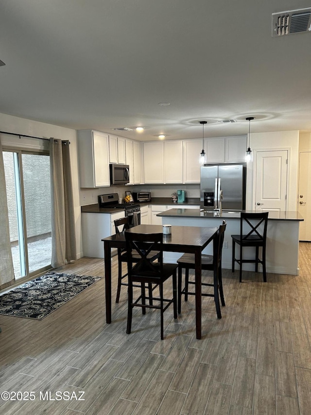 1126 E Descent St, Tucson, AZ 85719 - dining area featuring wood finished floors