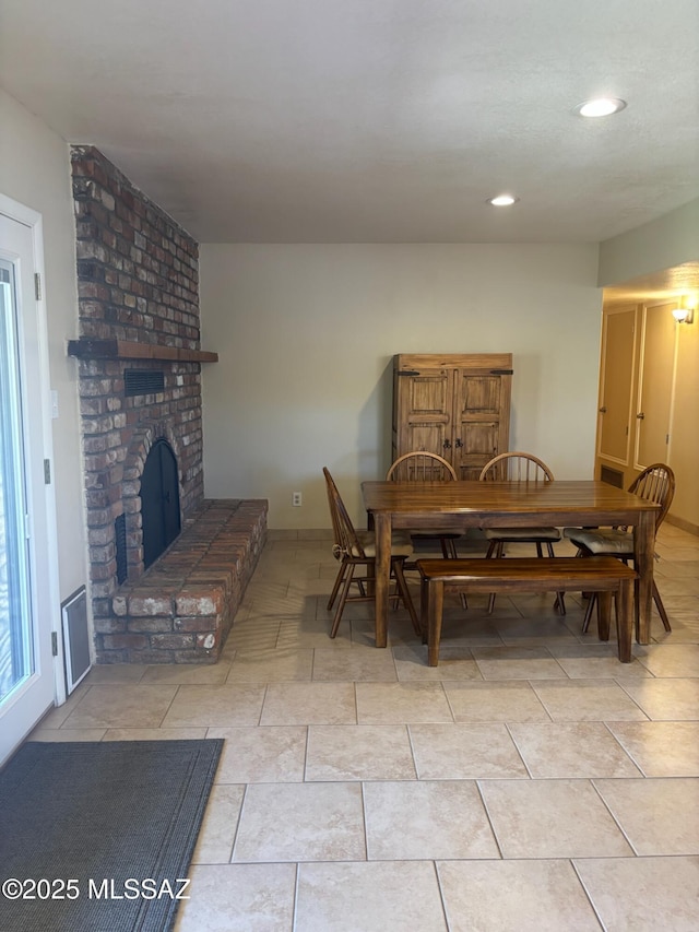 6100 N La Canada Dr, Tucson, AZ 85704 - dining room with a brick fireplace and recessed lighting