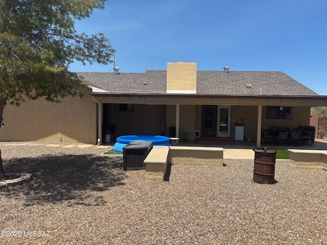 6100 N La Canada Dr, Tucson, AZ 85704 - back of house with a patio area, stucco siding, and roof with shingles