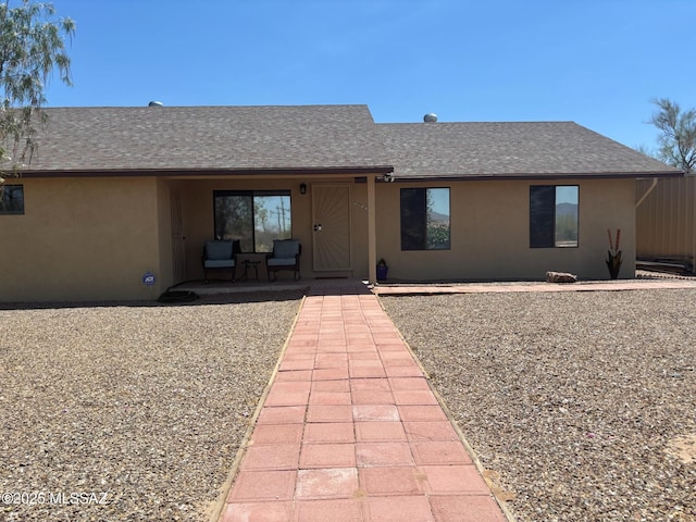 6100 N La Canada Dr, Tucson, AZ 85704 - view of front of property featuring stucco siding and a shingled roof