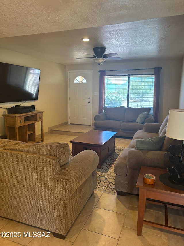 6100 N La Canada Dr, Tucson, AZ 85704 - living room with a textured ceiling, light tile patterned floors, and a ceiling fan