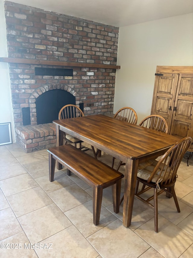 6100 N La Canada Dr, Tucson, AZ 85704 - dining area with light tile patterned flooring and a fireplace
