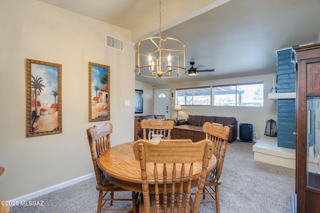 6951 E Hayne Pl, Tucson, AZ 85710 - carpeted dining area with a chandelier and ceiling fan