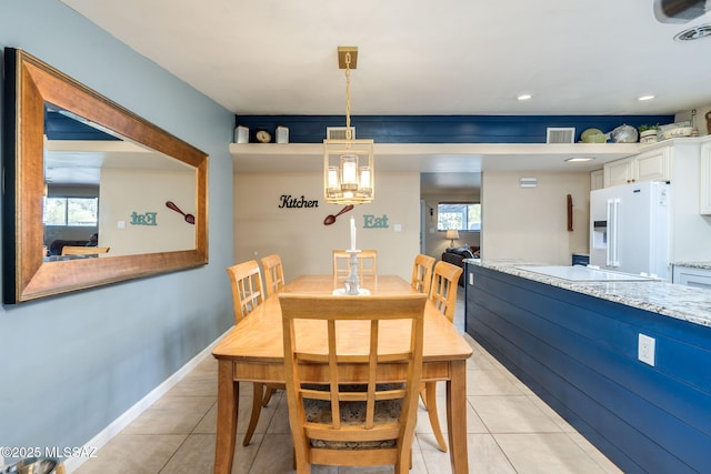 6951 E Hayne Pl, Tucson, AZ 85710 - dining area featuring light tile patterned flooring and recessed lighting