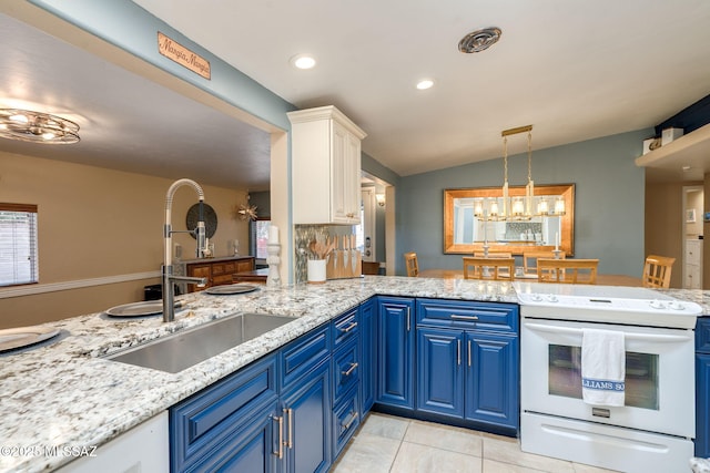 6951 E Hayne Pl, Tucson, AZ 85710 - kitchen featuring white electric stove, blue cabinets, lofted ceiling, white cabinetry, and recessed lighting