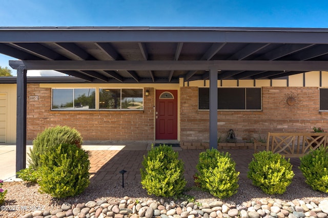 6951 E Hayne Pl, Tucson, AZ 85710 - entrance to property featuring brick siding