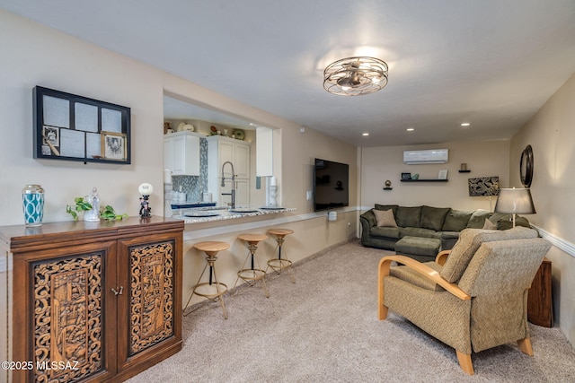 6951 E Hayne Pl, Tucson, AZ 85710 - carpeted living area featuring an AC wall unit and recessed lighting