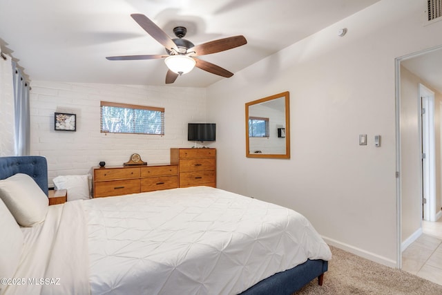 6951 E Hayne Pl, Tucson, AZ 85710 - bedroom with light carpet and a ceiling fan