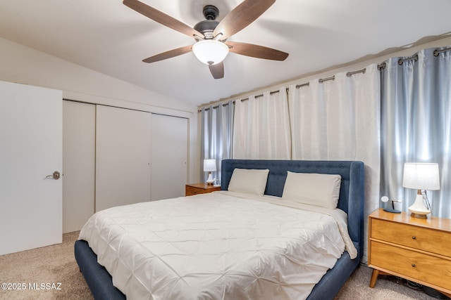 6951 E Hayne Pl, Tucson, AZ 85710 - carpeted bedroom with vaulted ceiling, a closet, and a ceiling fan