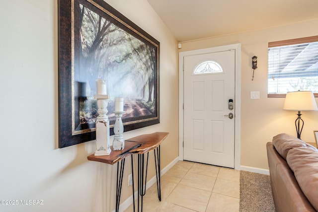6951 E Hayne Pl, Tucson, AZ 85710 - foyer entrance with baseboards and light tile patterned flooring