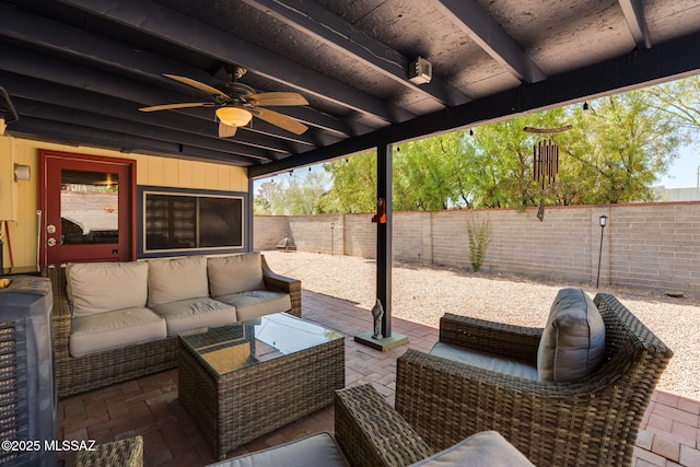 6951 E Hayne Pl, Tucson, AZ 85710 - fenced backyard featuring an outdoor living space, ceiling fan, and a patio area