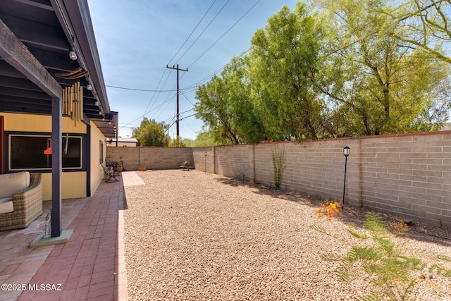 6951 E Hayne Pl, Tucson, AZ 85710 - fenced backyard featuring a patio area