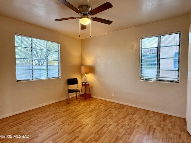 1412 E Silver St, Tucson, AZ 85719 - unfurnished room with light wood-style floors and a ceiling fan