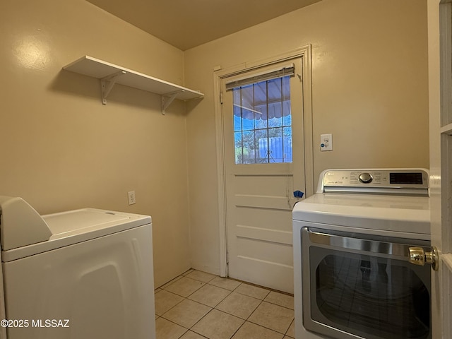 1412 E Silver St, Tucson, AZ 85719 - laundry room featuring independent washer and dryer and light tile patterned floors