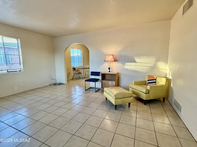 1412 E Silver St, Tucson, AZ 85719 - living area with arched walkways and light tile patterned flooring