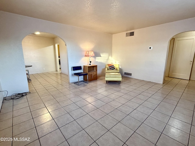 1412 E Silver St, Tucson, AZ 85719 - sitting room featuring arched walkways and light tile patterned flooring