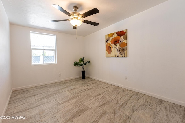 1435 E Grant Rd, Tucson, AZ 85719 - spare room with a ceiling fan and baseboards