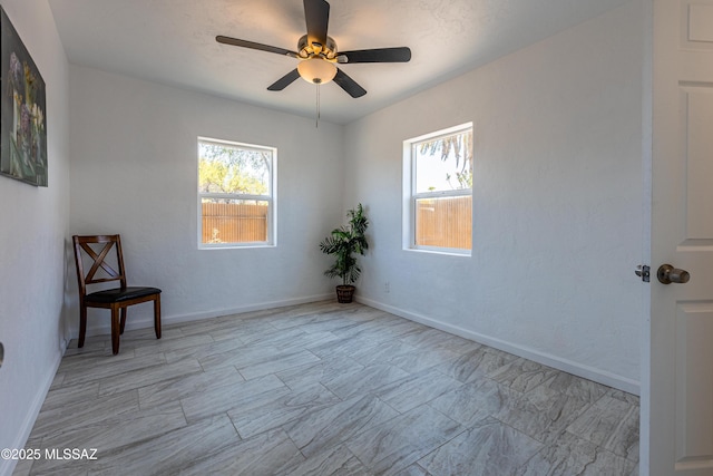 1435 E Grant Rd, Tucson, AZ 85719 - spare room with a ceiling fan and baseboards
