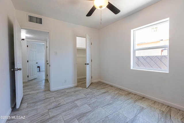 1435 E Grant Rd, Tucson, AZ 85719 - unfurnished bedroom with ceiling fan and a closet