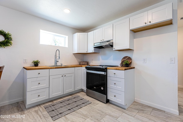 1435 E Grant Rd, Tucson, AZ 85719 - kitchen with butcher block counters, stainless steel range with electric stovetop, under cabinet range hood, and white cabinets