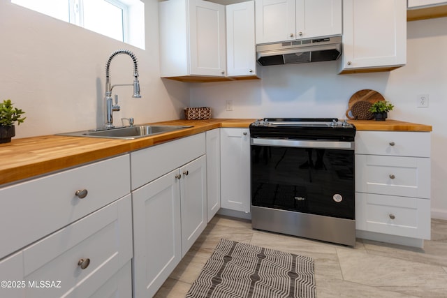 1435 E Grant Rd, Tucson, AZ 85719 - kitchen with butcher block countertops, stainless steel range with electric stovetop, range hood, and white cabinetry