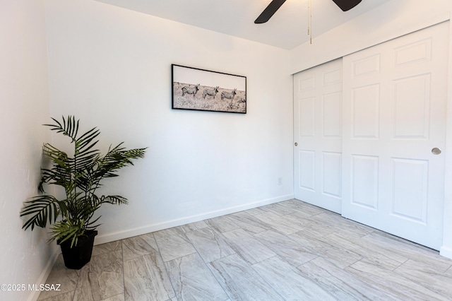 1435 E Grant Rd, Tucson, AZ 85719 - unfurnished bedroom featuring a ceiling fan and a closet