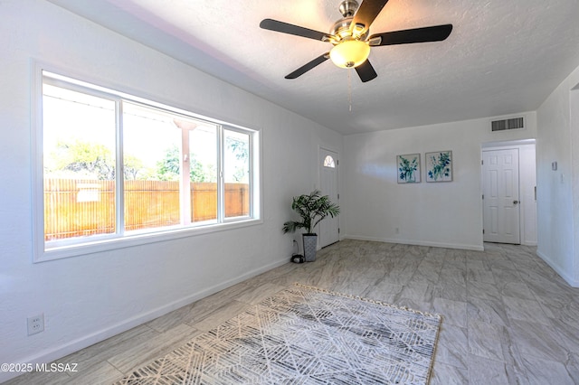1435 E Grant Rd, Tucson, AZ 85719 - spare room with a ceiling fan and a textured ceiling