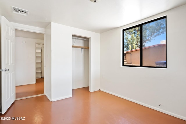 4009 N Fontana Ave, Tucson, AZ 85705 - unfurnished bedroom featuring concrete flooring and a closet