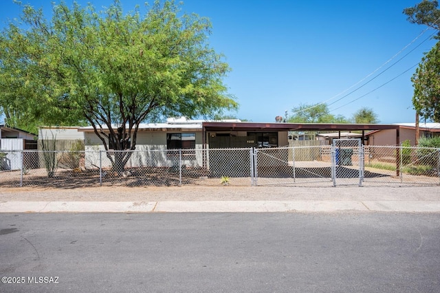 4009 N Fontana Ave, Tucson, AZ 85705 - manufactured / mobile home with a fenced front yard, a gate, and a carport