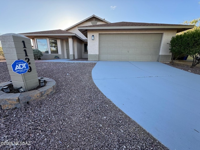 1129 W Amberbrooke Ave, Tucson, AZ 85745 - single story home with stucco siding, a garage, and driveway
