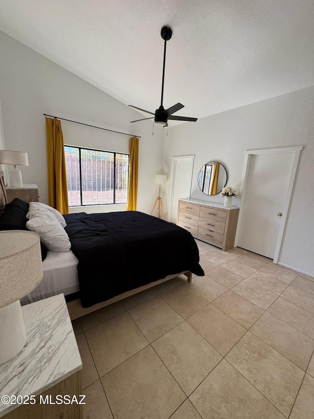 1129 W Amberbrooke Ave, Tucson, AZ 85745 - bedroom with light tile patterned flooring, vaulted ceiling, and a ceiling fan