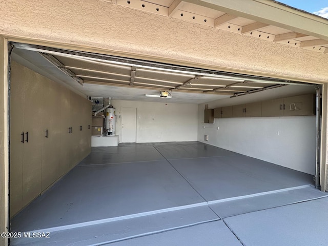 1129 W Amberbrooke Ave, Tucson, AZ 85745 - garage with gas water heater, a garage door opener, and electric panel