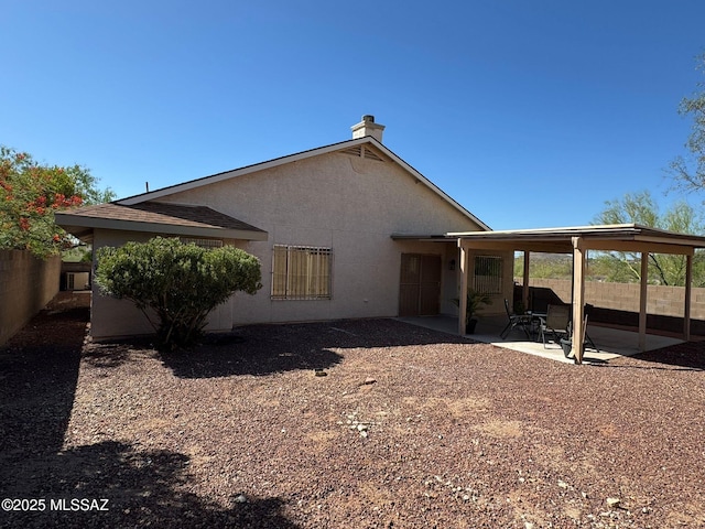 1129 W Amberbrooke Ave, Tucson, AZ 85745 - rear view of property featuring a patio and stucco siding