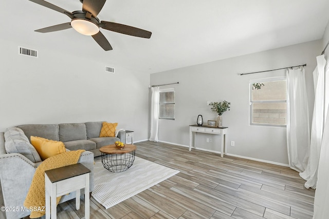 7705 W Taltson Dr, Tucson, AZ 85743 - living room featuring ceiling fan and light wood-type flooring
