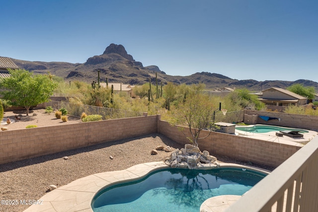 7705 W Taltson Dr, Tucson, AZ 85743 - view of swimming pool featuring a mountain view and a fenced backyard