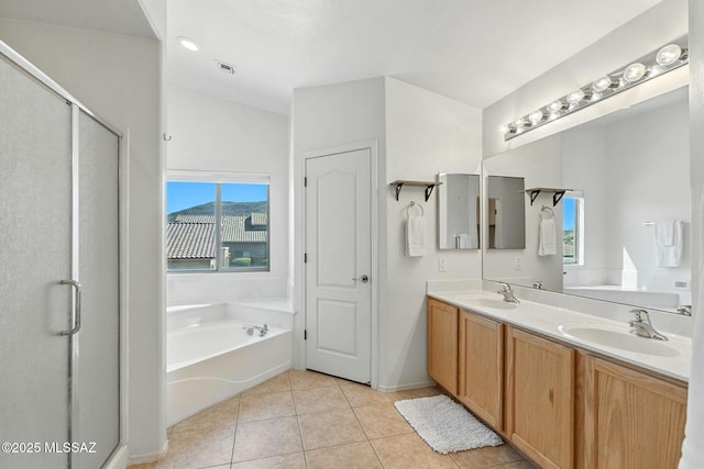 7705 W Taltson Dr, Tucson, AZ 85743 - bathroom featuring a bath, double vanity, a stall shower, tile patterned floors, and lofted ceiling
