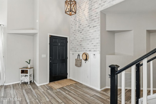 7705 W Taltson Dr, Tucson, AZ 85743 - entryway with a towering ceiling and wood tiled floors