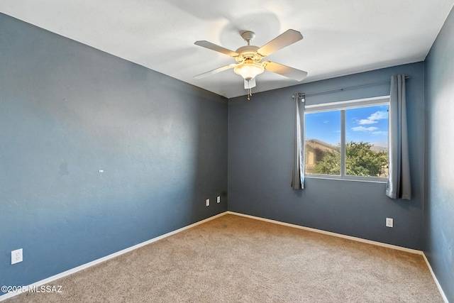 7705 W Taltson Dr, Tucson, AZ 85743 - carpeted spare room featuring baseboards and a ceiling fan