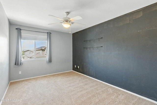 7705 W Taltson Dr, Tucson, AZ 85743 - carpeted spare room featuring ceiling fan and baseboards