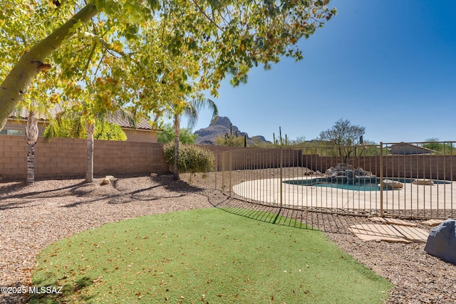 7705 W Taltson Dr, Tucson, AZ 85743 - fenced backyard with a patio area