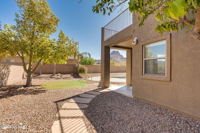 7705 W Taltson Dr, Tucson, AZ 85743 - fenced backyard with a balcony and a patio area