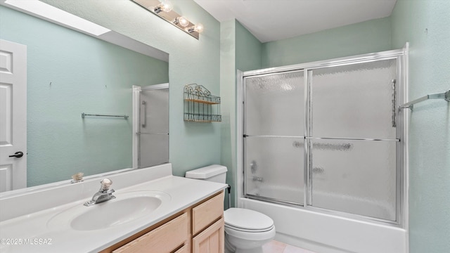 2315 E Chrysanthemum St, Oro Valley, AZ 85755 - bathroom featuring vanity, shower / bath combination with glass door, and a skylight