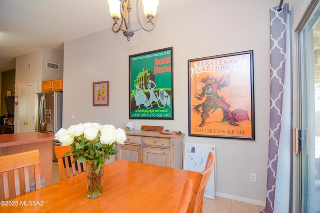 9495 N Winter Wren Ave, Tucson, AZ 85742 - dining area with a chandelier and light tile patterned flooring