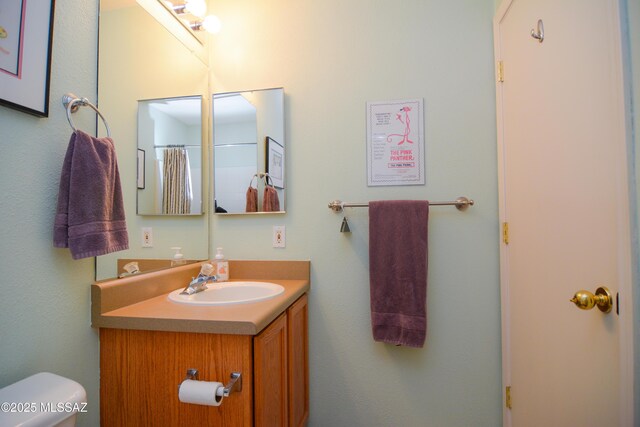 9495 N Winter Wren Ave, Tucson, AZ 85742 - bathroom with vanity and toilet