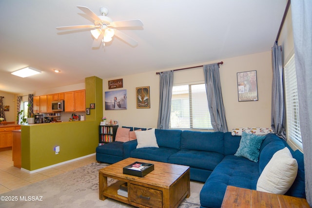 9495 N Winter Wren Ave, Tucson, AZ 85742 - living room with light tile patterned floors and a ceiling fan