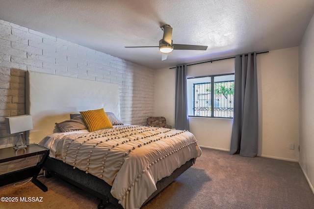 1310 N Dorado Blvd, Tucson, AZ 85715 - carpeted bedroom featuring a textured ceiling, ceiling fan, and brick wall