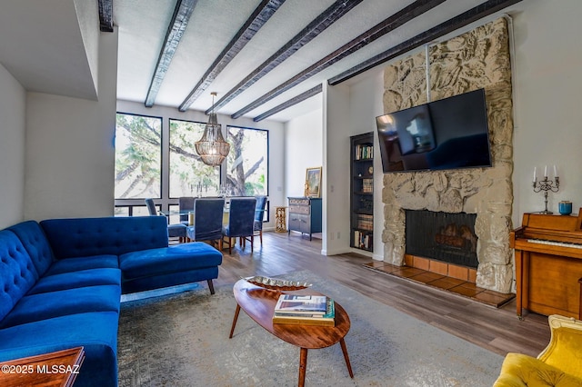 1310 N Dorado Blvd, Tucson, AZ 85715 - living area featuring wood finished floors, a fireplace, and beamed ceiling